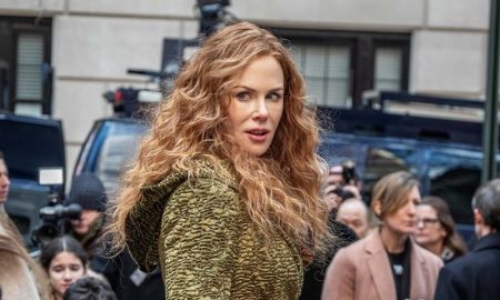 Nicole Kidman in a brown dress posesa  picture.